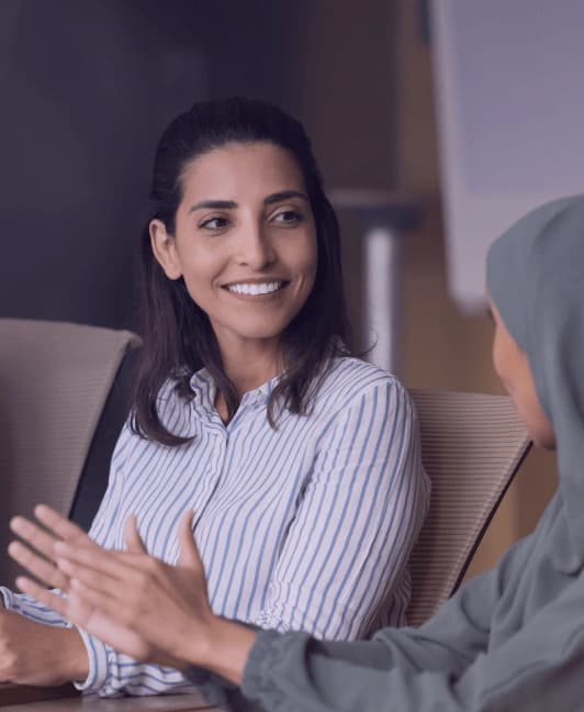 Smiling business professionals in the UAE optimizing their business processes