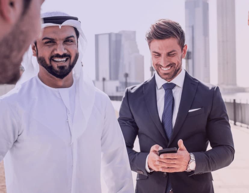 Happy entrepreneurs in UAE successfully streamlining their business operations