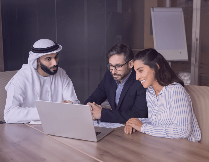 Smiling professionals in UAE benefiting from streamlined compliance processes