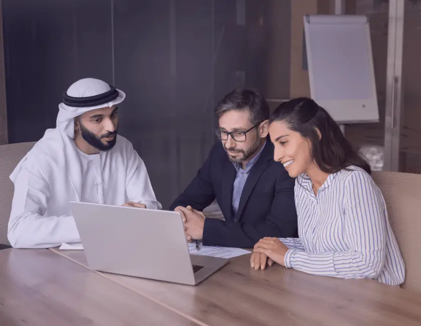 Smiling professionals in UAE benefiting from streamlined compliance processes