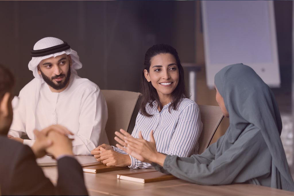 Image of employees discussing inside the conference room.